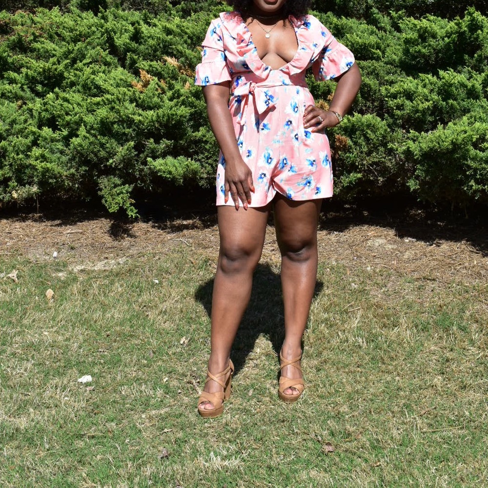 Ruffle sleeve and front romper with vibrant flower design